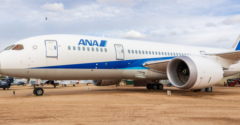 N787EX ANA Boeing 787 Dreamliner with some A-10s flying in the background